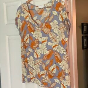 Beautiful summer top, cap, sleeves, trimmed in lace. Never worn.